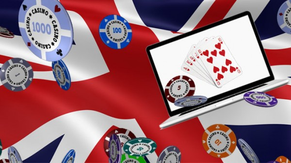 union jack flag with online casino chips and a laptop for online gambling.